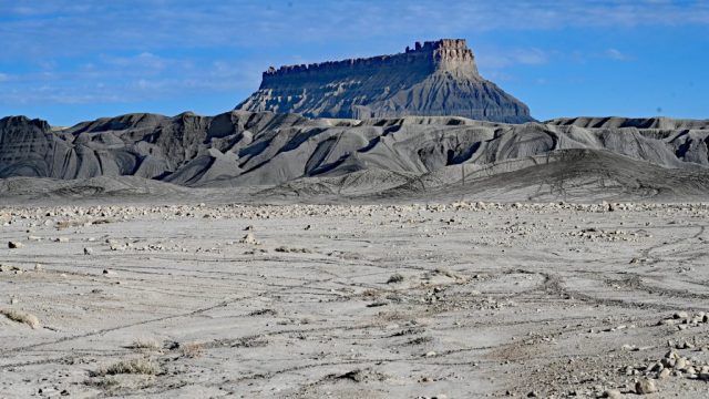 contrast layers – grey rock capped with bright red sandstone.