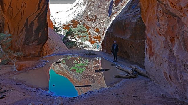 waterhole beneath navajo arch
