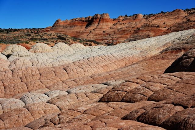 The wide smooth rock slopes like waves of stone and distant crater-like formations dsc 6438