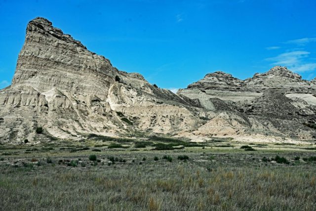 Majestic Rock Walls in the Sunlight – The fascinating view looking back at the steep, bright cliffs of Eagle Rock. nz7 9003