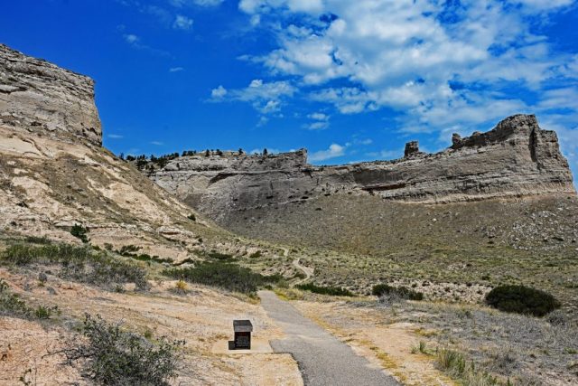 • 9007: The Path Through History – Switchbacks of the trail between Sentinel Rock and Eagle Rock under a blue sky. nz7 9007