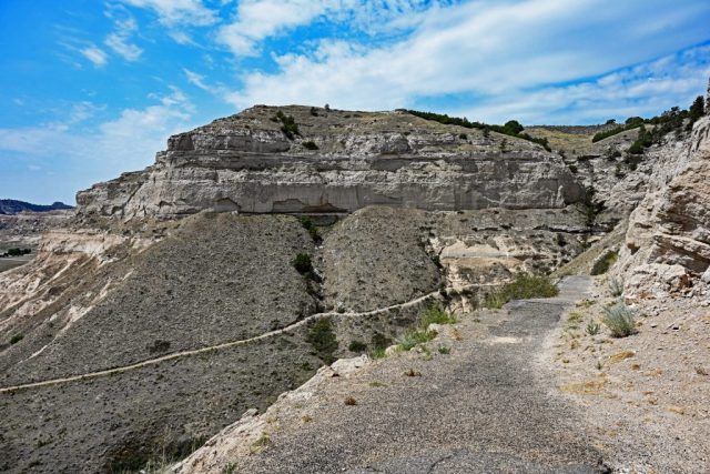 The Switchbacks of the Saddle Rock Trail – Looking back at the winding ascent path in front of the massive wall of South Bluff. nz7 9009