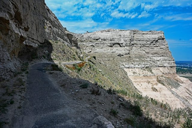 Outlook into the Vastness – The shaded path after the tunnel, looking out at the sun-drenched North Bluff and the river valley. nz7 9011